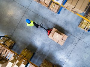 Pallet storage in Wythenshawe walking through warehouse space.