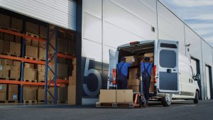 Warehouse workers doing two man delivery out of warehousing in Worthing. 