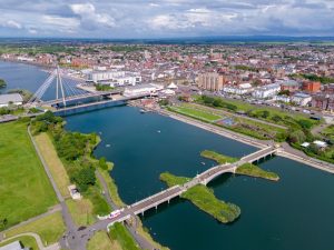 Southport river showing distribution channels and warehousing alongside it. 
