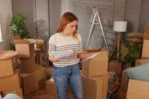 Female entrepreneur managing e-commerce stock at home before switching to professional warehousing and fulfilment