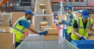 Fulfilment centre staff picking and packing e-commerce orders for UK start-ups