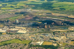 Aerial view of Scunthorpe steelworks industrial estate with warehousing nearby and fulfilment routes shown.