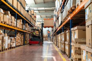 Warehousing Salford wiht pallet stoage and forklift moving cargo for e-commerce fulfilment.