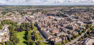 Aerial view of Harrogate with warehouse space and HGVs doing logistics in the background.