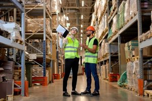 Workers doing stock management and logistics inside warehouse in Chatham Kent.