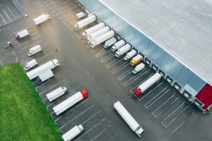 Aerial view of trucks at loading doors of distribution centre in Warrington. 