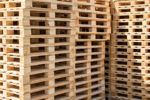 Euro pallets stacked in yard. 