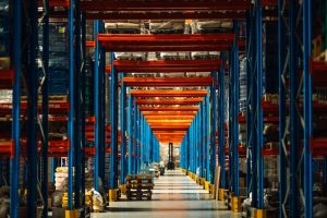 Forklift at the end of racking tunnel for pallet storage. 