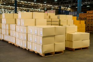 Standard pallet storage with boxes on top of them. 