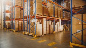 Pallet storage on racking in large warehouse. 