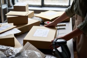 Value added services such as labelling being done for order fulfilment inside Mansfield warehousing. 