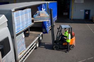 Pallet storage being loaded into a HGV for cross channel haulage.