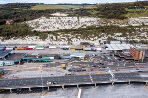 Dover Port with UK haulage companies HGVs lined up to board a ferry for cross channel freight.