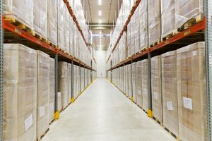 Interior of warehousing in Cheshire with pallets on wither side of hallway. 