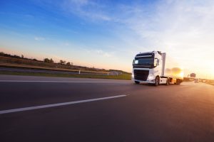 HGV moving freight for fulfilment on motorway using fuel.