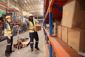 Warehouse workers doing returns management of ecommerce goods.