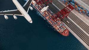Multimodal freight forwarding showcasing an cargo plane and a cargo ship.