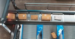 3PL in Bebington using a conveyor belty to pick and pack order for fulfilment in Liverpool.