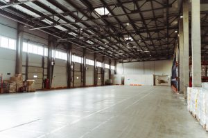 Large empty warehouse in Exeter with space for pallet storage.