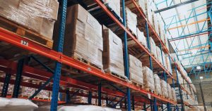 Pallet storage of boxes on racking inside Bebington warehousing.