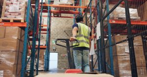 Pallet truck being moved by warehouse worker in Beeston. 