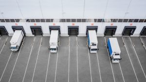 Aerial shot of multiple HGVs leaving a 3PL in Kingswinford from loading docks.