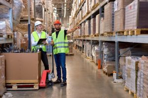 Warehouse workers looking at pallet storage in Kingswinford.