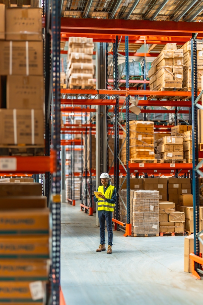 3PL worker looking for stock to be picked and packed inside Moseley warehousing. 