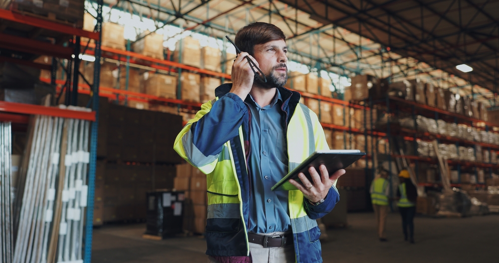 Warehouse worker in Ohio with a tablet doing inventory management. 