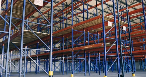 Empty pallet storage racking inside warehousing with available space. 