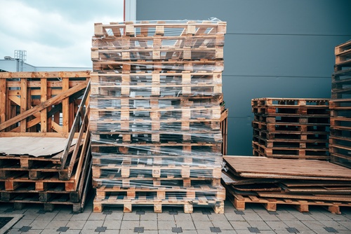 A stack of UK wooden pallets shrink wrapped. 