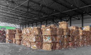Stacked bales of cardboard that have been used by a warehouse for fulfilment and 3PL purposes.