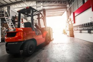 Open loading dock of warehousing in Havant with a forklift moving a pallet through.