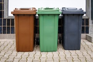 Different coloured bins for waste segregation.
