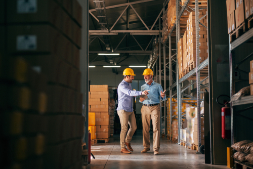 Warehousing workers looking at pallets for fulfilment.